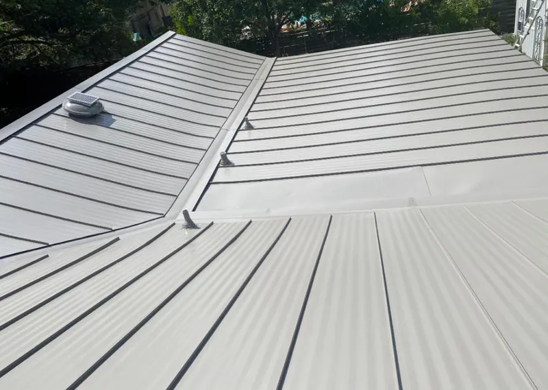 Solar attic fan installed on a metal roof for Roof Ventilation in Pinole